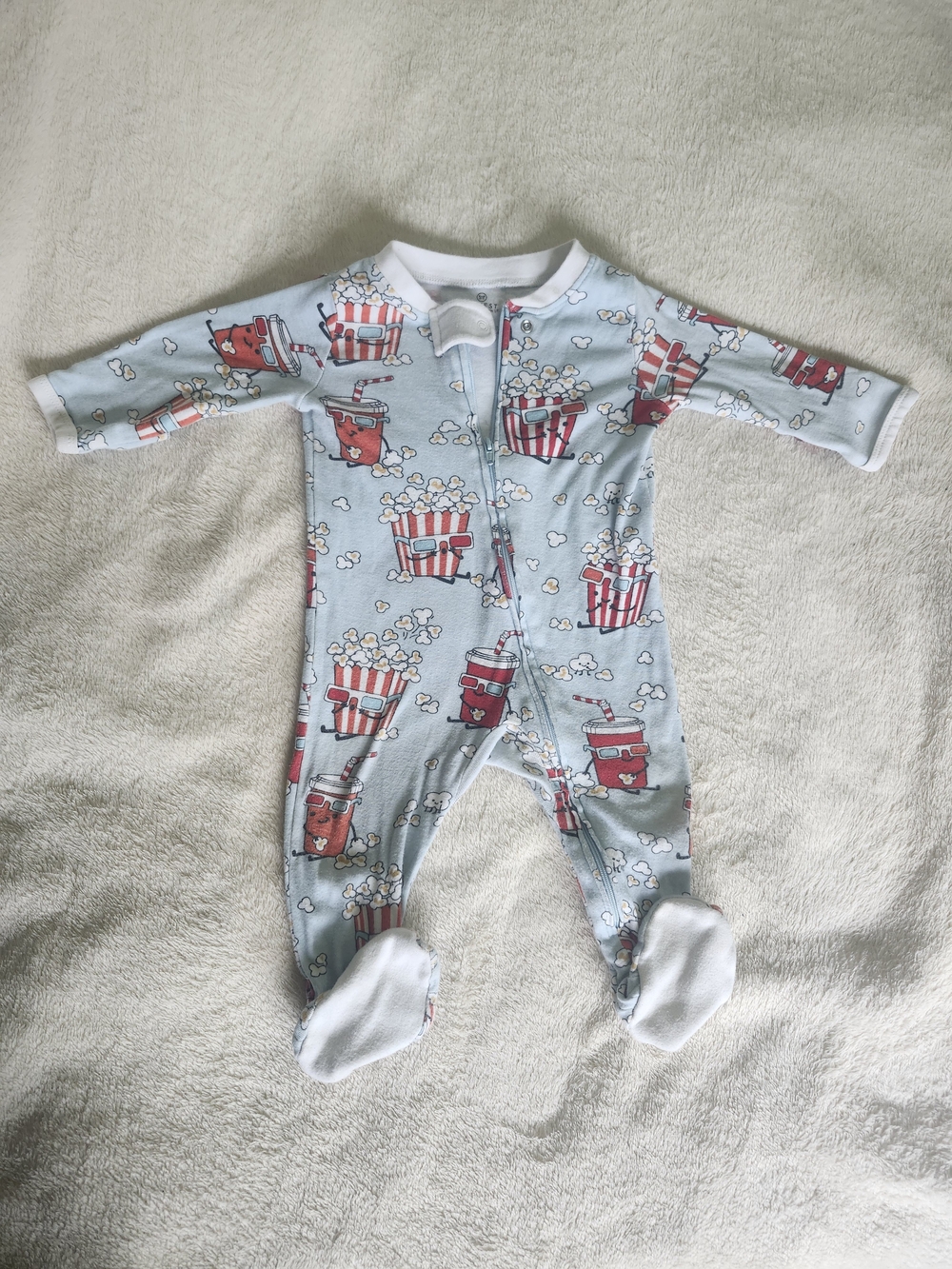 The Honest Company Light Blue Popcorn & Soda Print Footed One-Piece